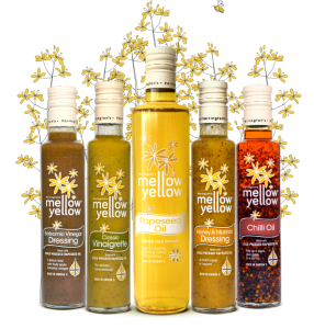 Farrington Oils Mellow Yellow rapeseed oil products with rapeseed plants backdrop