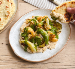 Baharat roasted cauliflower with a butterbean hummus and coriander dressing